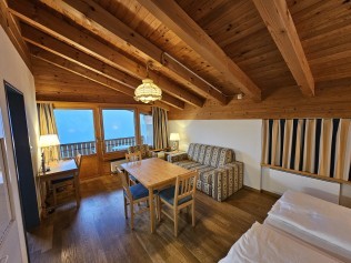 Wohn- und Schlafzimmer - Aparthotel Muchetta