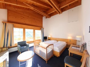 Wohn- und Schlafzimmer - Aparthotel Muchetta