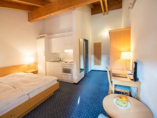 Wohn- und Schlafzimmer - Aparthotel Muchetta
