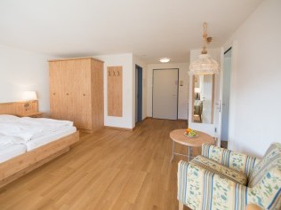Wohn- und Schlafzimmer - Aparthotel Muchetta