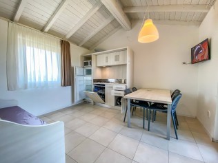 Wohnzimmer mit Essbereich - Belvedere Village