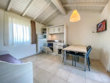 Wohnzimmer mit Essbereich - Belvedere Village