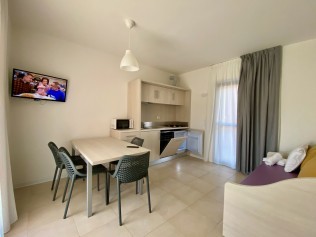 Wohnzimmer mit Essbereich - Belvedere Village