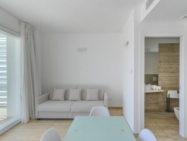 Wohnzimmer mit Essbereich - Capo Falcone Charming Apartments