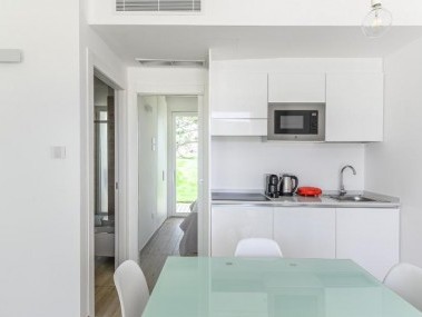 Wohnzimmer mit Essbereich - Capo Falcone Charming Apartments