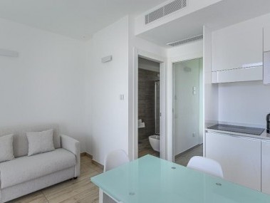 Wohnzimmer mit Essbereich - Capo Falcone Charming Apartments