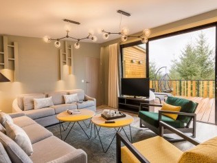 Salon avec coin repas - Center Parcs Les Trois Forêts