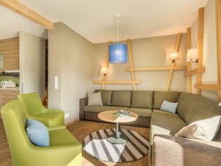 Salon avec coin repas - Center Parcs Park Allgäu