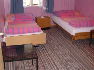 Schlafzimmer - Erlebnishof Farnere Swiss-Lodge