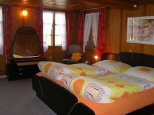 Schlafzimmer - Erlebnishof Farnere Swiss-Lodge