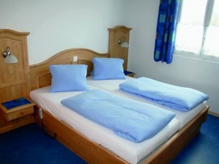 Schlafzimmer - Erlebnishof Farnere Swiss-Lodge