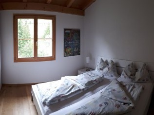 Schlafzimmer - Ferienhaus Albulablick