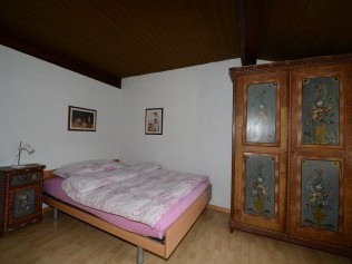 Schlafzimmer - Ferienhaus Chasa Moffa