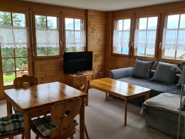 Salon avec coin repas - Maison de vacances Chumma