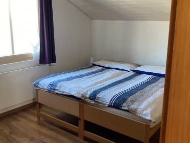 Schlafzimmer - Ferienhaus Dorfblick
