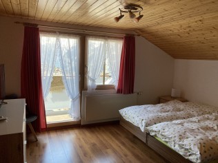 Schlafzimmer - Ferienhaus Dorfblick