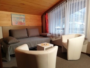 Wohnzimmer - Ferienhaus Floralpina