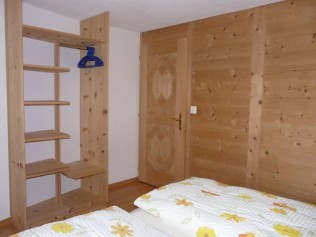 Schlafzimmer - Ferienhaus Flüehblüemli