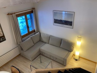 Wohnzimmer mit Essbereich - Ferienhaus Margun