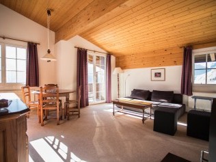 Wohnzimmer mit Essbereich - Ferienpark Alpine Village