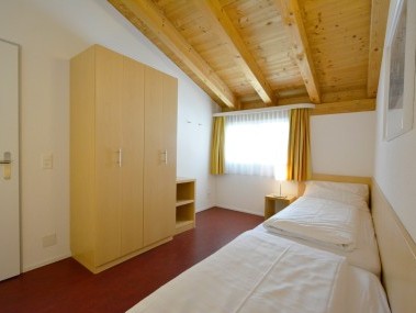 Schlafzimmer - Ferienresidenz Surses Alpin