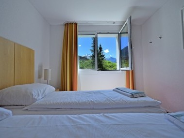 Schlafzimmer - Ferienresidenz Surses Alpin