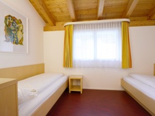 Schlafzimmer - Ferienresidenz Surses Alpin