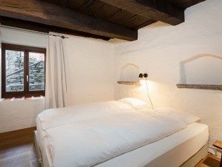 Schlafzimmer - Feriensiedlung Rustici della Verzasca