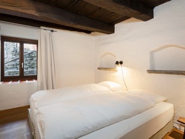 Schlafzimmer - Feriensiedlung Rustici della Verzasca