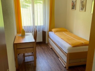 Schlafzimmer - Feriensiedlung Stockenmatt