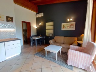 Wohnzimmer mit Essbereich - Park Residence Il Gabbiano