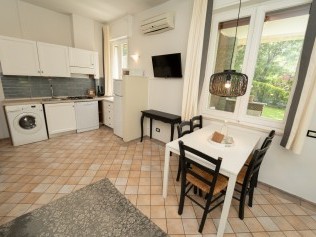 Wohnzimmer mit Essbereich - Park Residence Il Gabbiano