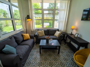 Salon avec coin repas - Park Residence Il Gabbiano