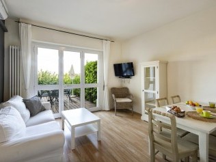 Wohnzimmer mit Essbereich - Park Residence Il Gabbiano