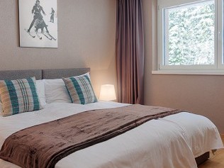 Schlafzimmer - Peaks Place Apartments