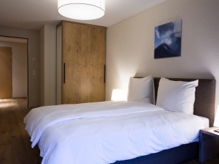 Schlafzimmer - Peaks Place Apartments