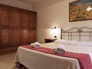 Schlafzimmer - Podere Monte Sixeri Residenze di Campagne