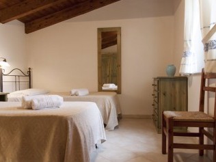 Schlafzimmer - Podere Monte Sixeri Residenze di Campagne