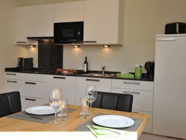 Küche mit Essbereich - PRIVÀ Alpine Lodge