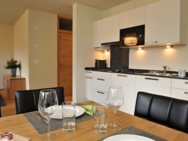 Küche mit Essbereich - PRIVÀ Alpine Lodge