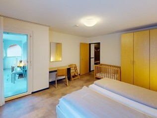 Schlafzimmer - Reka-Feriendorf Bergün