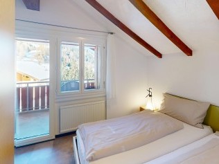 Schlafzimmer - Reka-Feriendorf Bergün