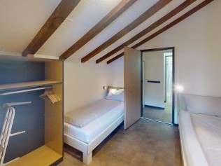 Schlafzimmer - Reka-Feriendorf Bergün