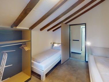 Schlafzimmer - Reka-Feriendorf Bergün