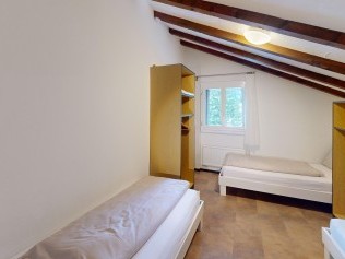 Schlafzimmer - Reka-Feriendorf Bergün