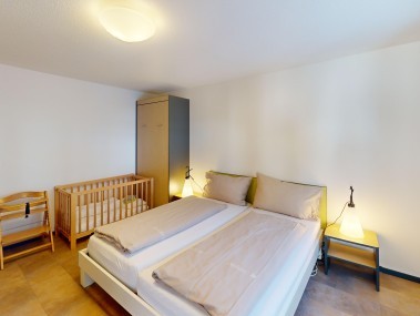 Schlafzimmer - Reka-Feriendorf Bergün