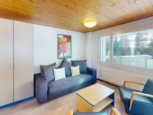 Wohnzimmer mit Essbereich - Reka-Feriendorf Bergün