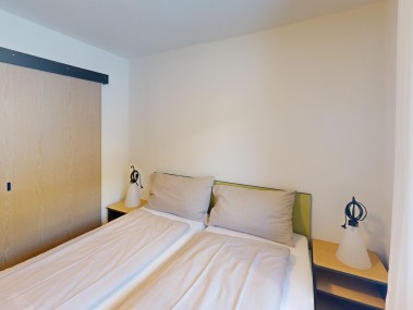 Schlafzimmer - Reka-Feriendorf Bergün