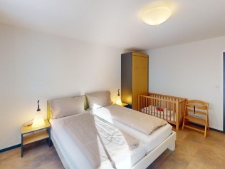 Schlafzimmer - Reka-Feriendorf Bergün