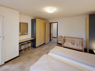 Schlafzimmer - Reka-Feriendorf Bergün